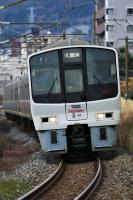 門司機関区前をゆく811系